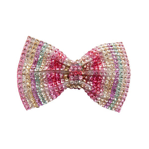 Multicolored beaded bow on a white background