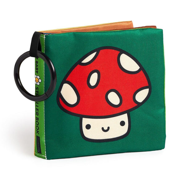 Children's book with a red and white mushroom illustration on a green background