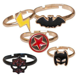 A set of children's superhero rings with various designs including a bat, a spider, and a star.