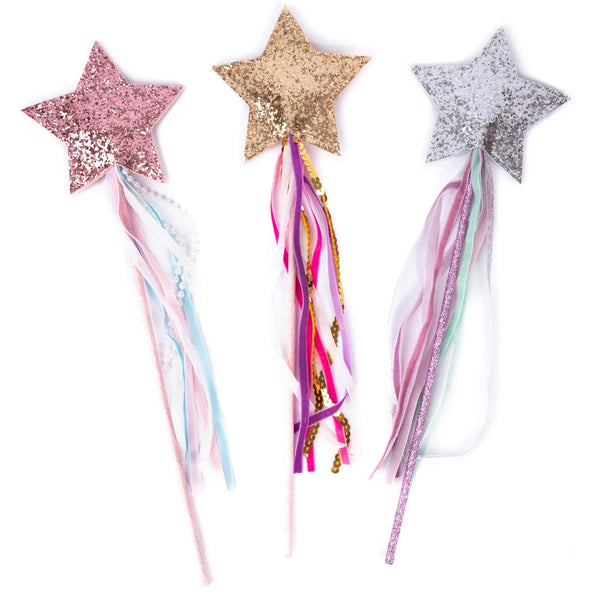 Three star-shaped wands with colorful ribbons on a white background