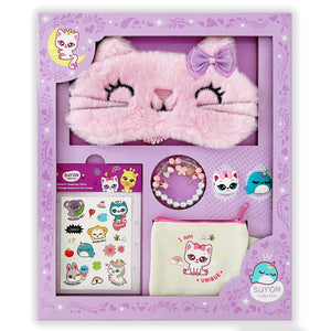 A gift set from Suyon featuring a pink faux fur sleep mask with cat ears and a bow, along with a bracelet, temporary tattoo, pouch, and two rings.