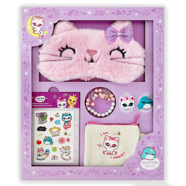 A gift set from Suyon featuring a pink faux fur sleep mask with cat ears and a bow, along with a bracelet, temporary tattoo, pouch, and two rings.