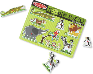 A colorful wooden sound puzzle featuring various zoo animals, with pegged pieces that include an elephant, giraffe, monkey, lion, parrot, zebra, and crocodile.