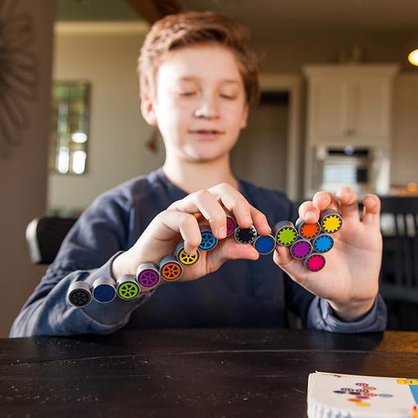 Child playing with colorful magnetic building blocks in a kitchen setting