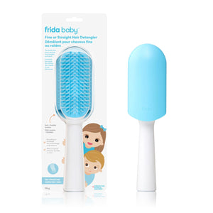 Frida baby hair detangler with blue bristle head and white handle on a white background