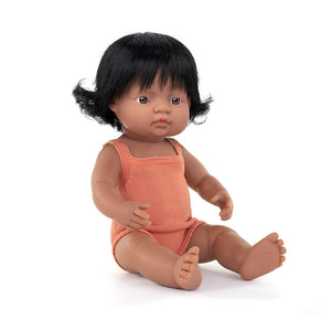 Doll with black hair wearing an orange outfit on a white background