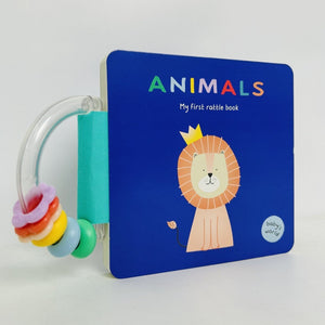 Children's book titled 'Animals: My first rattle book' with a lion illustration on a blue background.