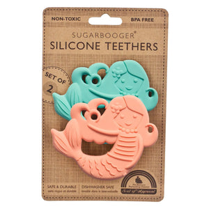 A set of two silicone teething toys designed to look like mermaids, packaged on a cardboard backing with adult supervision note.