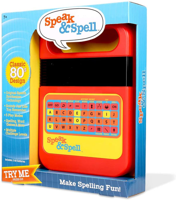 The product image shows the 'Speak and Spell' educational toy packaging. The packaging is predominantly red and yellow with text and a clear window displaying the product inside.