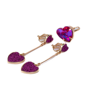 Heart-shaped earrings with purple and red heart designs on a white background