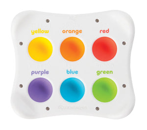 A colorful educational toy consisting of a white panel with silicone buttons in various colors, each labeled with the color name and corresponding word in Braille.