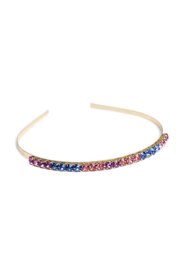A multicolored chunky gem headband with a metallic band and studded with pink, purple, and blue gems.