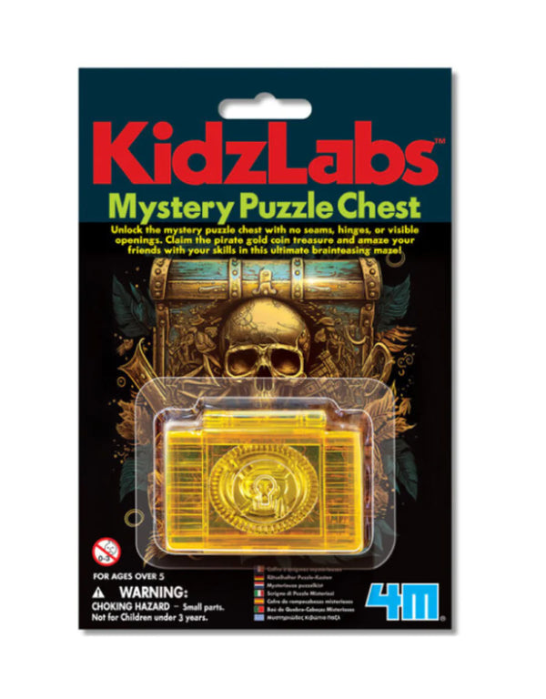 Packaging of Kidz Labs Mystery Puzzle Chest with the product visible through a clear plastic window, featuring a gold-colored puzzle piece and an illustration of a skull.