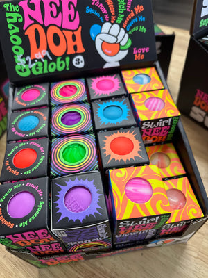 Colorful toy blocks with vibrant packaging in a display box.