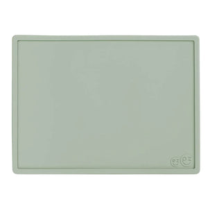 Light green silicone placemat with a brand logo on a white background