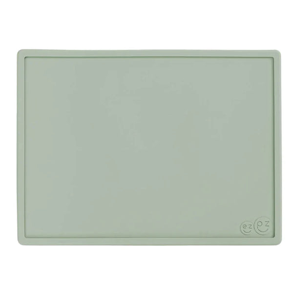 Light green silicone placemat with a brand logo on a white background