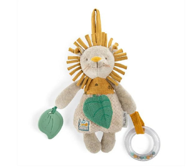 Plush lion toy with green leaf and ring on a white background