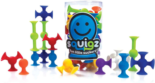 Colorful squigz toys with packaging on a white background