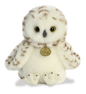 Plush owl toy with a tag on a white background