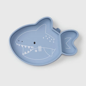 Blue shark-shaped plate on a light gray background