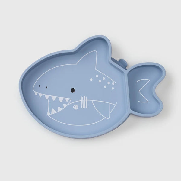 Blue shark-shaped plate on a light gray background