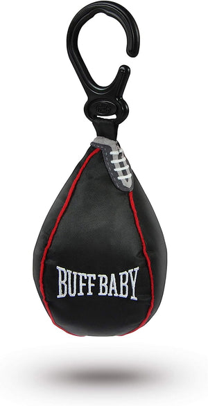 A miniature speed bag hanging toy with 'BUFF BABY' text, black with red accents, and a sensory crinkle layer, attached to a carabiner.