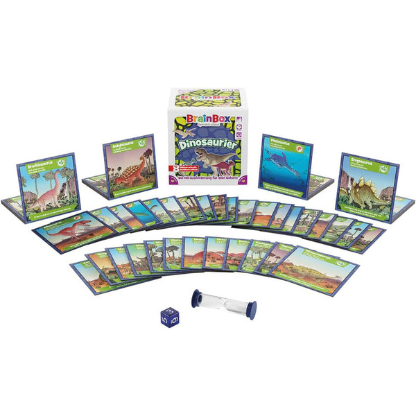 Dinosaur-themed educational game set with cards, dice, and timer on a white background