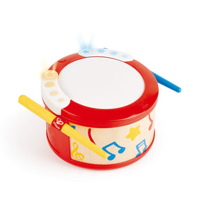 A colorful children's drum toy with red, yellow, and blue elements, including sticks and a musical note design.