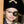 A child dressed as a pirate wearing a black eye patch with a skull and crossbones design.