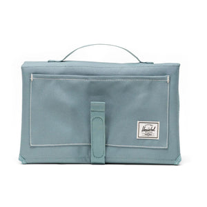 Light blue pouch with a strap on a white background
