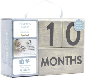 Wooden blocks with '10 months' text and Pearhead packaging