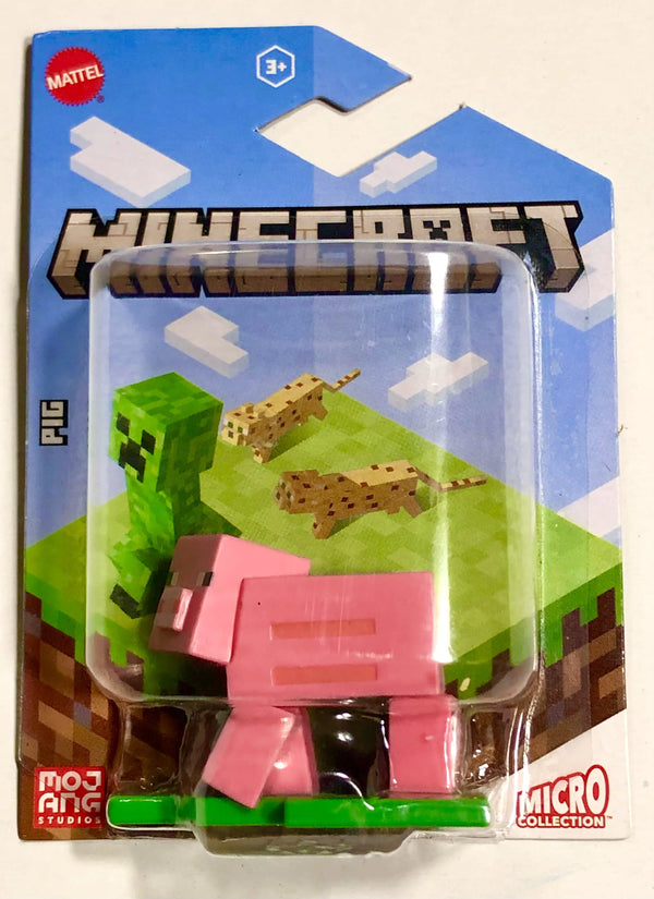 Minecraft toy figure in packaging with pink pig and green creeper design.