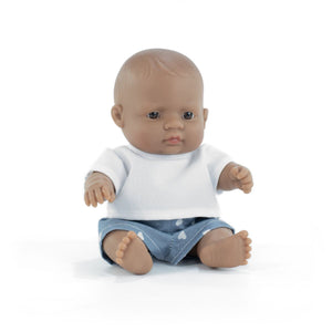 Baby doll with a white shirt and blue jeans on a white background