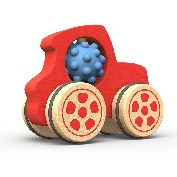 Red toy car with wooden wheels and a blue textured ball inside on a white background