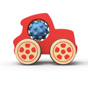 Red toy car with a blue textured ball inside on a white background