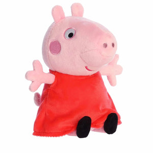 Plush toy of a pink character in a red dress on a white background