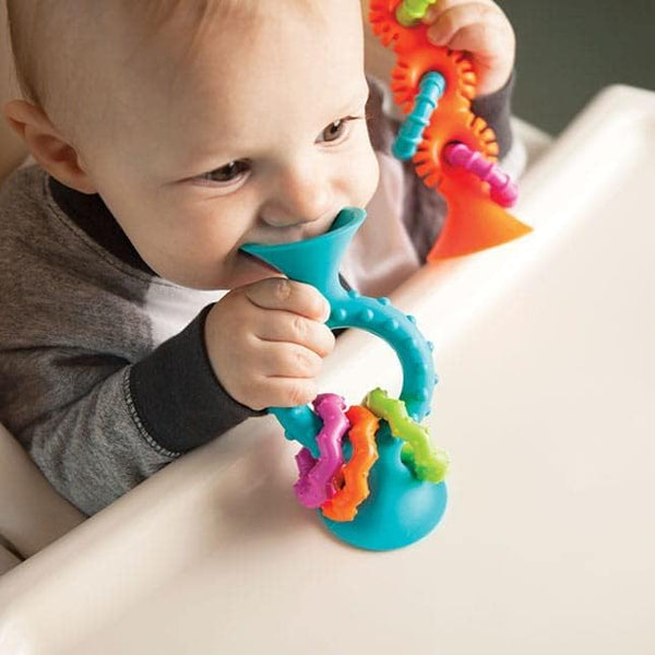 Baby playing with colorful teething ring