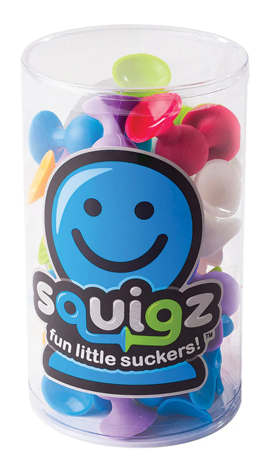A clear plastic tube with the Squigz logo on the label, filled with multicolored suction toys.