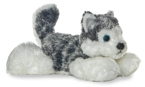 Plush toy husky lying on a white background