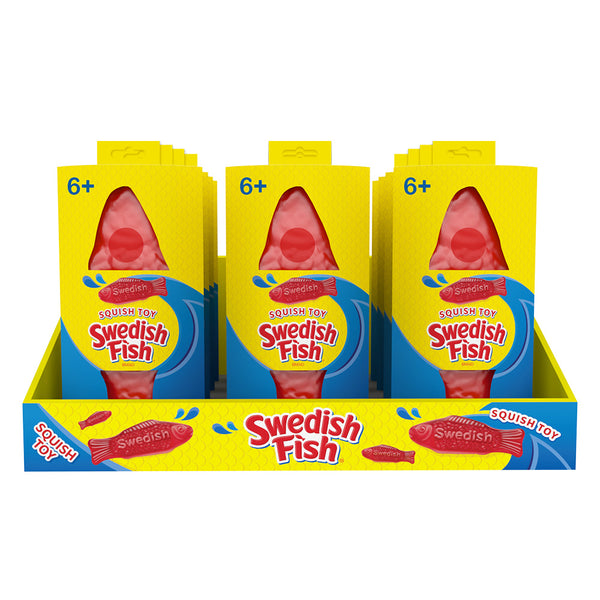 Display of Swedish Fish squish toys in yellow packaging on a white background