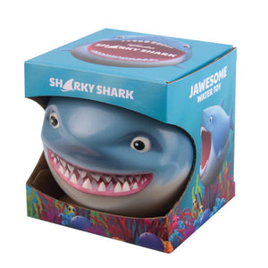 Shark toy with colorful packaging on a white background
