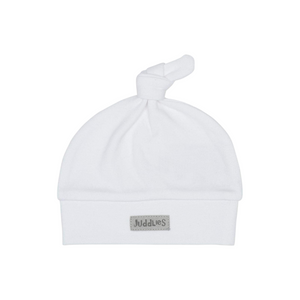White baby hat with a knot on top on a white background