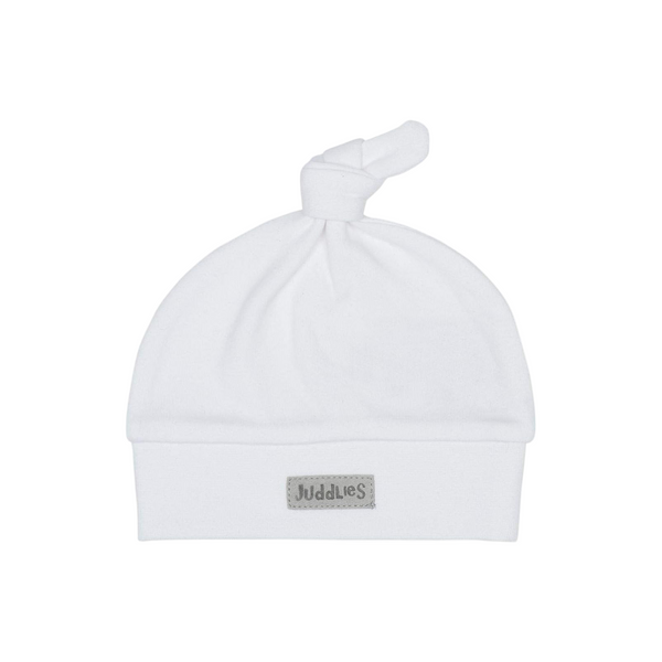 White baby hat with a knot on top on a white background