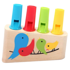 Colorful wooden toy with bird illustrations and four whistles on a white background