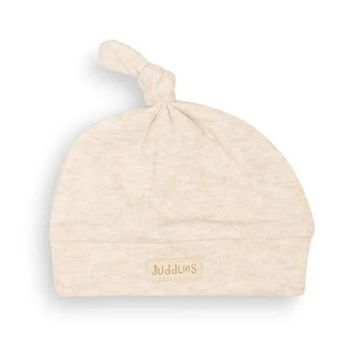 Beige baby hat with 'Juddlies' branding on a white background