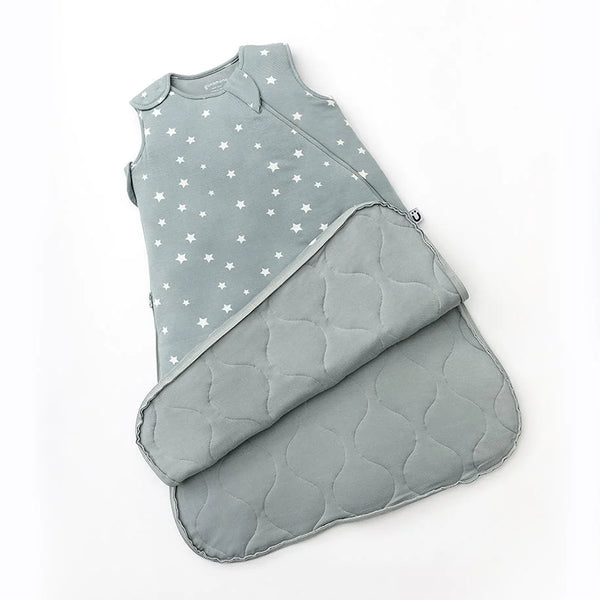 A gray sleep bag with white stars pattern, designed for babies, with a zipper.