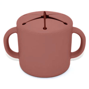 Brown sippy cup with lid on a white background
