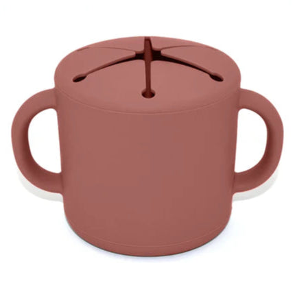 Brown sippy cup with lid on a white background