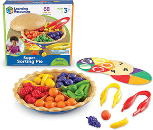 A colorful educational toy set called 'Learning Resources Super Sorting Pie' which includes a plastic pie plate with counters, three double-sided sorting cards, and two jumbo tweezers.
