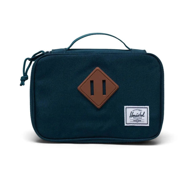 Navy blue toiletry bag with a brown square patch on a white background